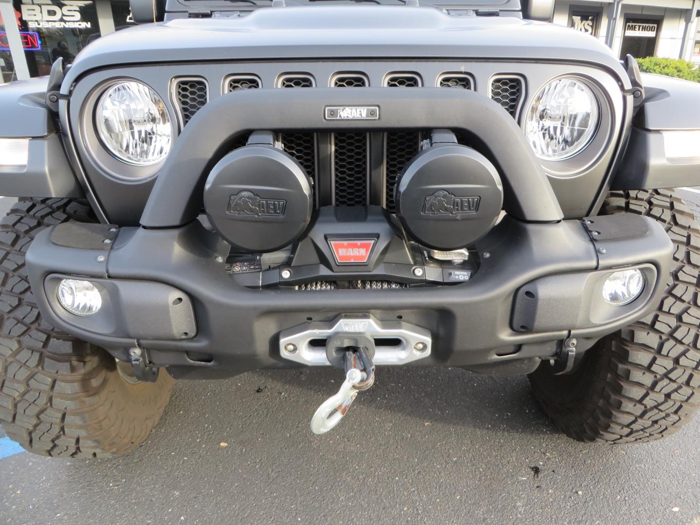 2020 BLACK /BLACK Jeep Wrangler Unlimited Rubicon (1C4HJXFGXLW) with an 3.6L V6 DOHC 24V FFV engine, 6A transmission, located at 2630 Grass Valley Highway, Auburn, CA, 95603, (530) 508-5100, 38.937893, -121.095482 - STANDARD CONTENT AEV RX Front Bumper AEV Front Skid Plate AEV Non-Winch Cover Plate AEV 7000 Series Lights AEV Light Cover Kit AEV 2.5" DualSport RT Suspension System AEV Front Geometry Correction Brackets AEV Steering Stabilizer AEV Rear Bumper AEV Swing-Out Tire Carrier AEV CHMSL Mount - Photo#10